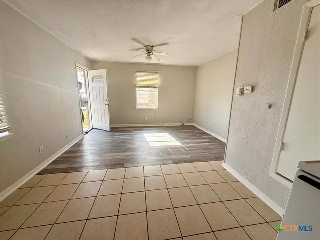 a view of an empty room and window