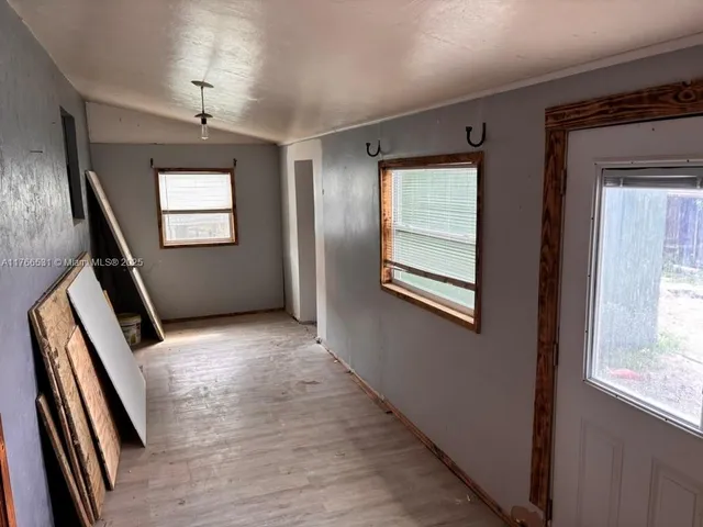 a bathroom with a sink mirror and toilet
