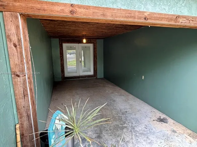 a view of a room with a large window