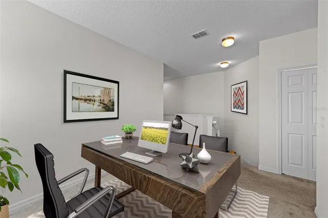 a workspace with furniture and window