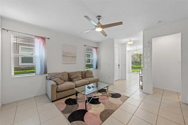 a living room with furniture and a window