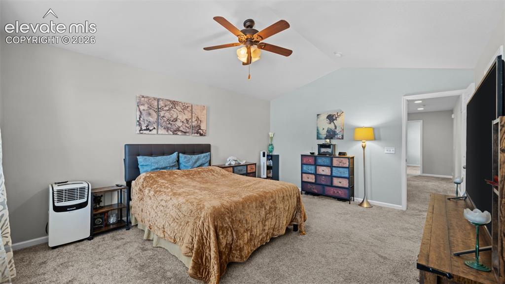 4023 Diamond Ridge View Colorado Springs, CO 80918 - Photo 23 of 31 a bedroom with a bed and a tv on table