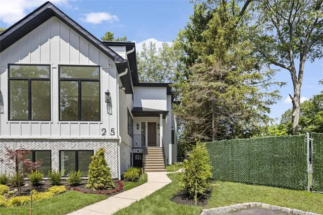 front view of a house with a yard