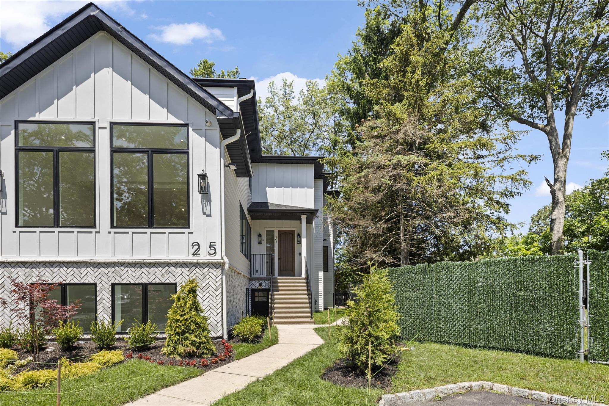 front view of a house with a yard