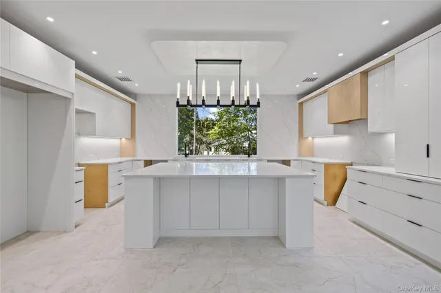 a kitchen with a sink cabinets and window
