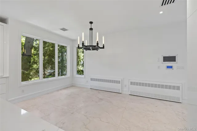 a view of empty room with floor to ceiling window