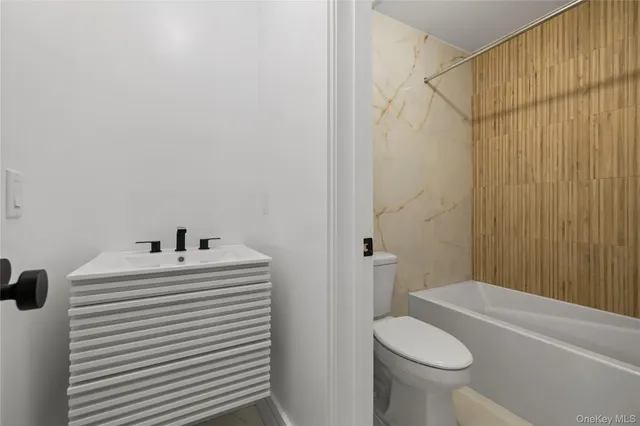 a kitchen with cabinets a sink and a stove top oven