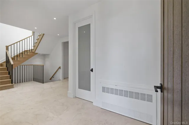 a view of an empty room with stairs