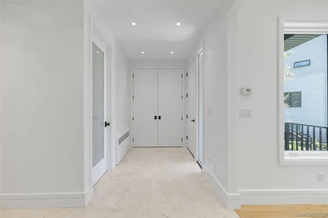 a view of hallway with windows