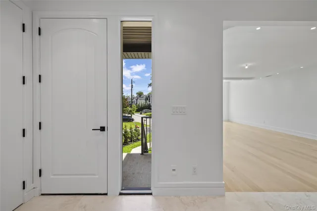 a view of hallway with wooden floor