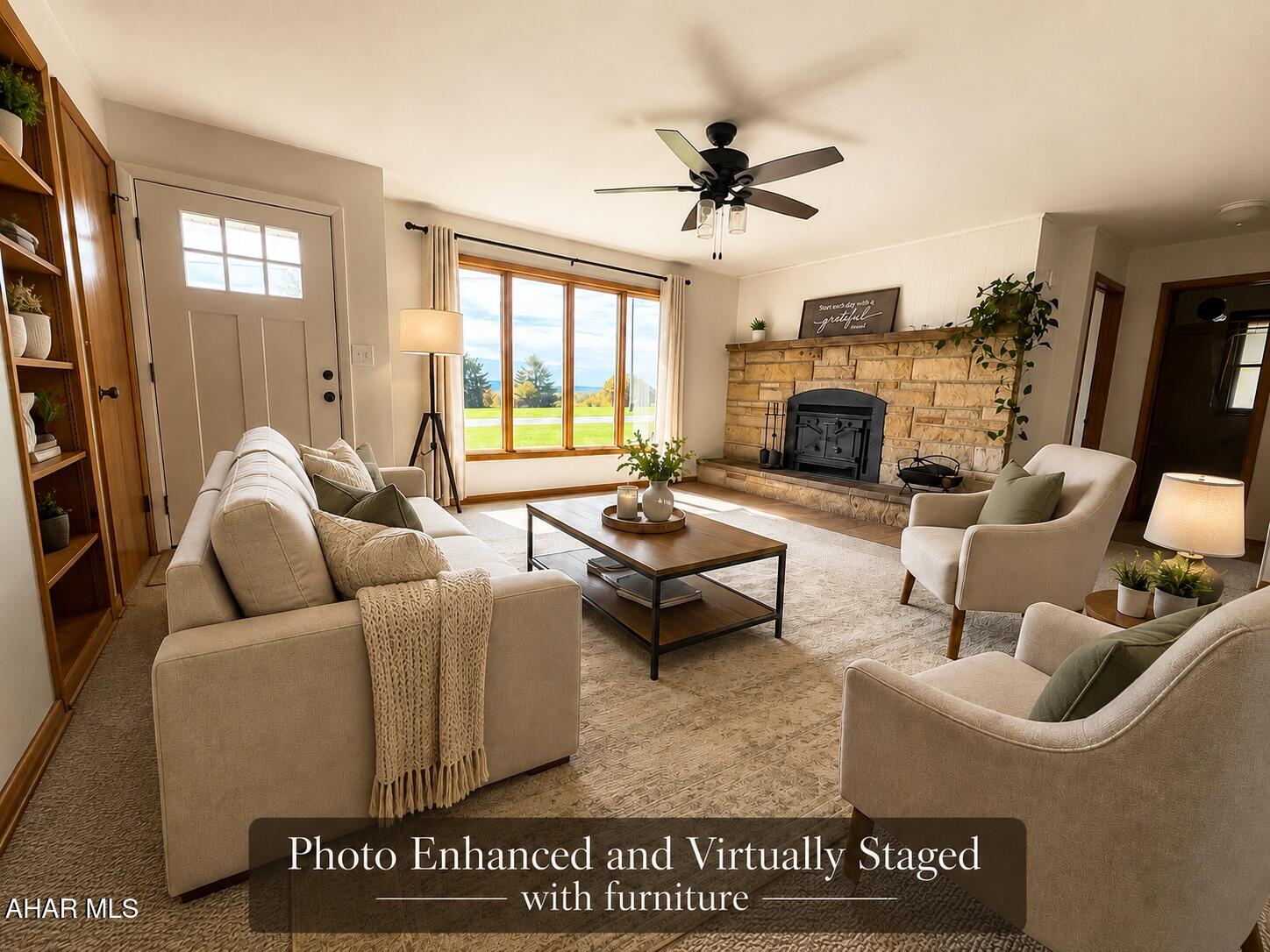 473 Calhoun Road Everett, PA 15537 - Photo 8 of 45 a living room with furniture ceiling fan and a fireplace