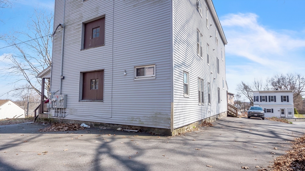 1442 Main Street, Unit 1 Worcester, MA 01603 - Photo 2 of 30 a view of a house with a yard