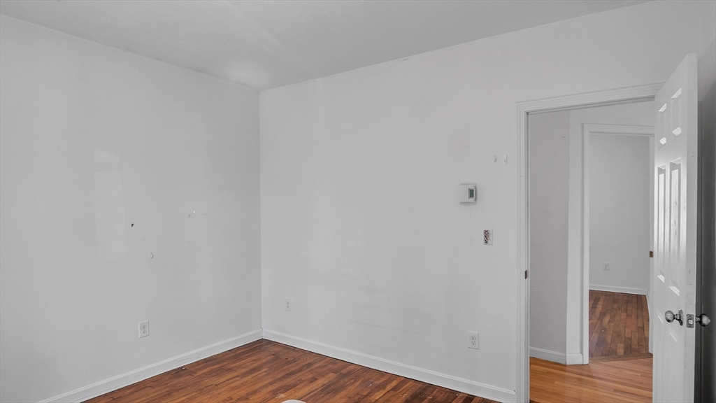 1442 Main Street, Unit 1 Worcester, MA 01603 - Photo 21 of 30 a view of a room with wooden floor