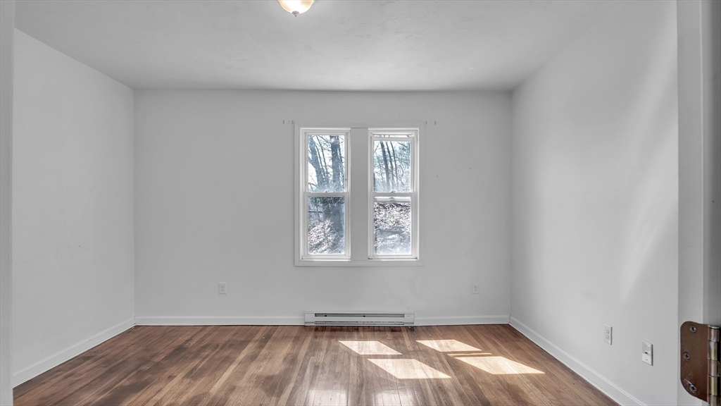 1442 Main Street, Unit 1 Worcester, MA 01603 - Photo 25 of 30 an empty room with a window