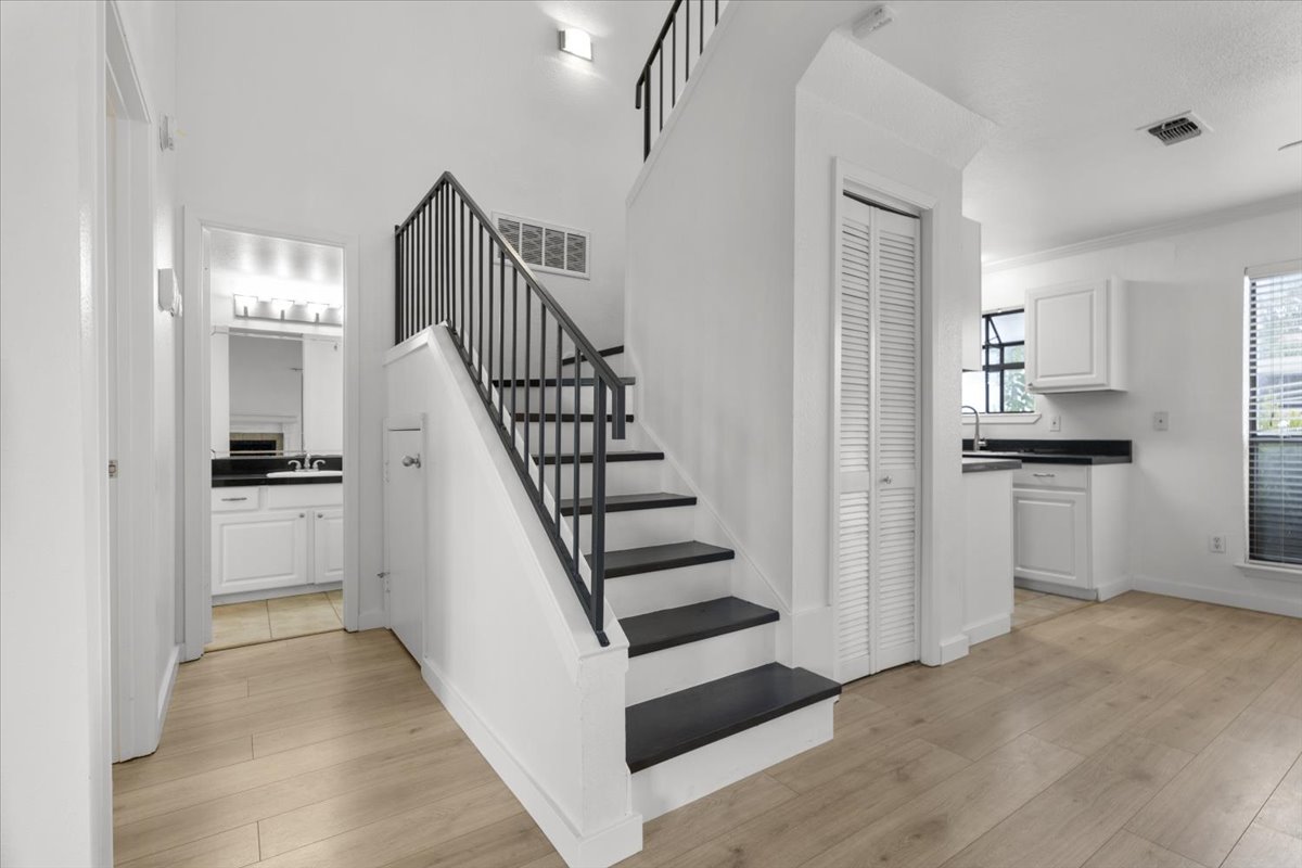 2018 West Rundberg Lane, Unit 9A Austin, TX 78758 - Photo 18 of 30 Stairs with solid wood floors heading up to the 2nd floor bedroom and bath.