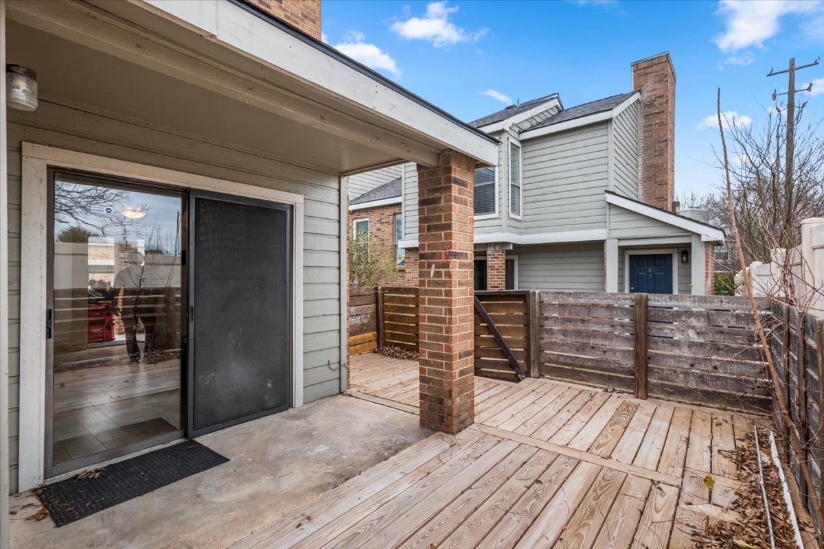 2018 West Rundberg Lane, Unit 9A Austin, TX 78758 - Photo 29 of 30 Covered patio with storage closet and new wooden deck with fence and no neighbors behind.