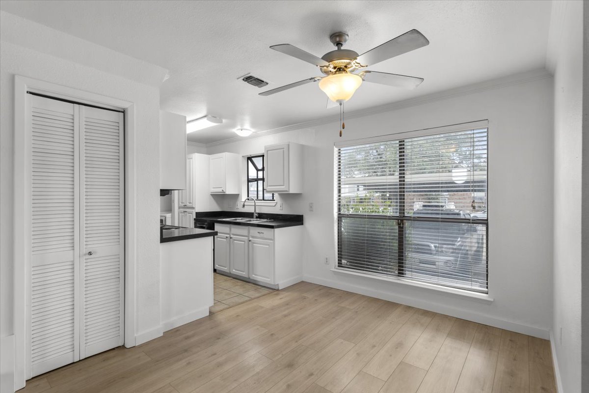 2018 West Rundberg Lane, Unit 9A Austin, TX 78758 - Photo 7 of 30 Dining room spilling into updated kitchen. Storage closet on left