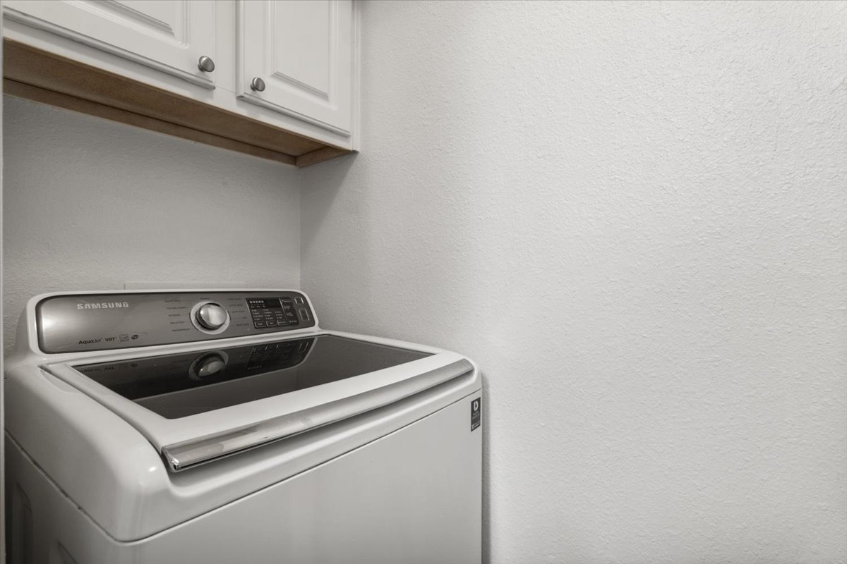 2018 West Rundberg Lane, Unit 9A Austin, TX 78758 - Photo 10 of 30 Laundry room with washer / dryer, and cabinet space.