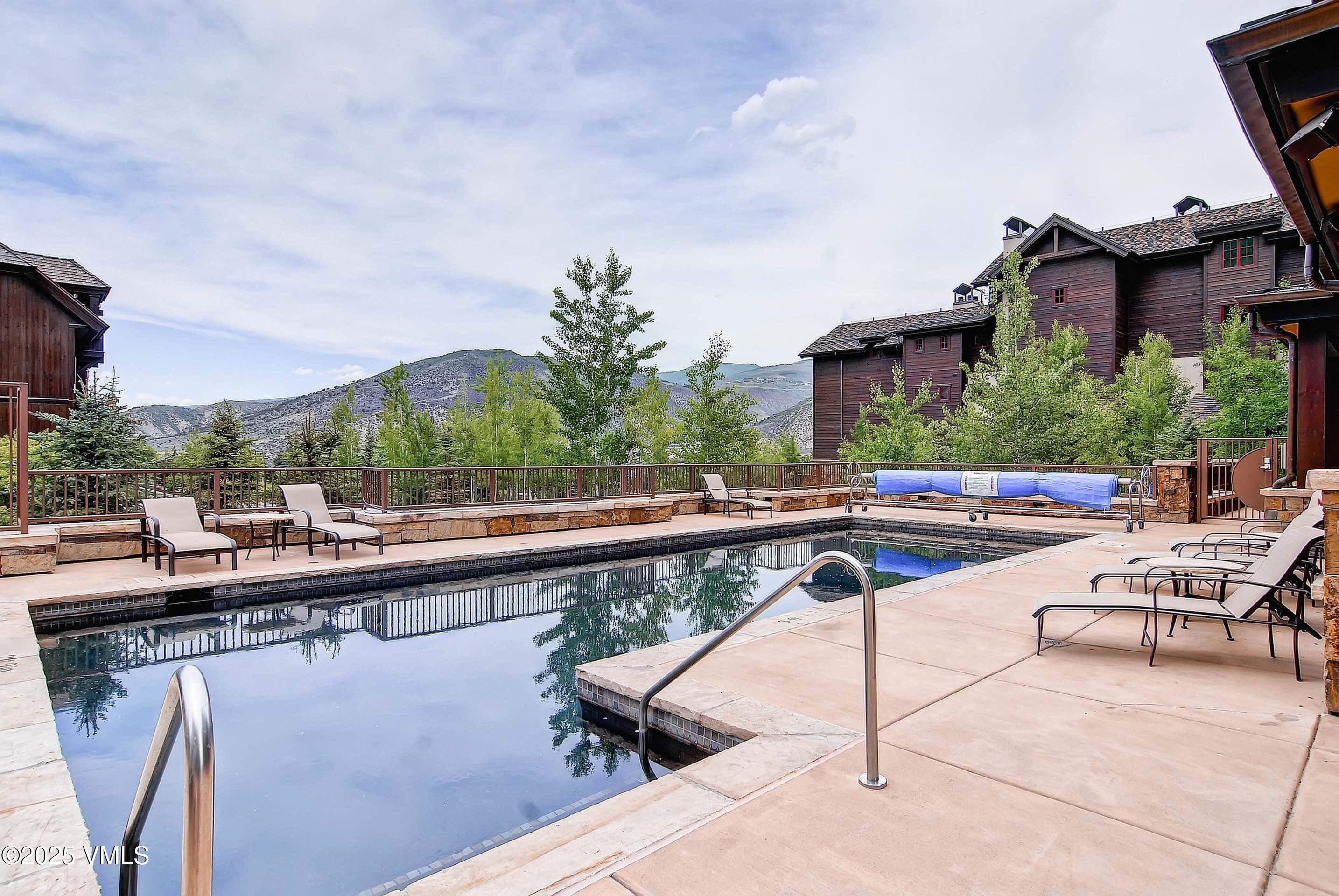 300 Prater Road, Unit A102 Beaver Creek, CO 81620 - Photo 13 of 17 a view of a swimming pool with outdoor seating and city view