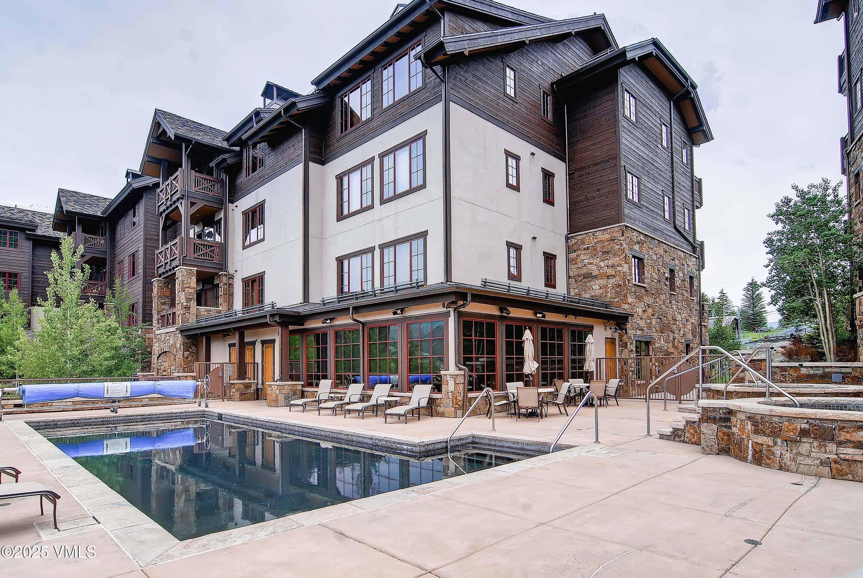 300 Prater Road, Unit A102 Beaver Creek, CO 81620 - Photo 5 of 10 a view of a building with sitting area and swimming pool