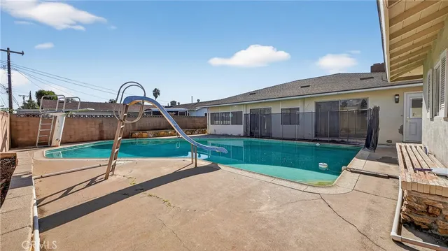 an aerial view of multiple houses with yard