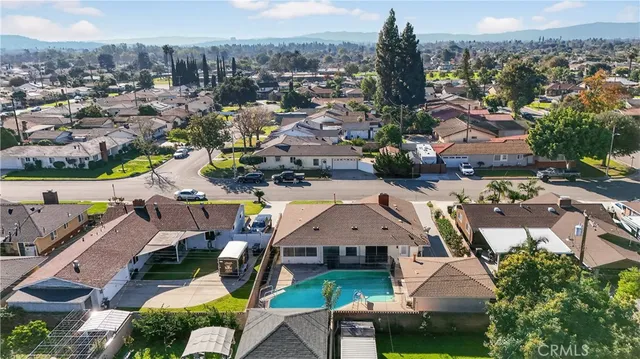 an aerial view of houses with outdoor space