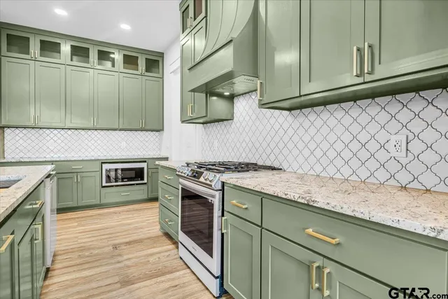 a view of room with window and wooden floor