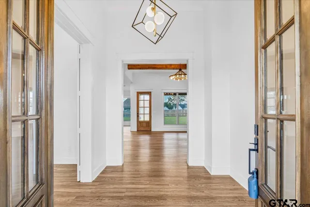 a view of an entryway with wooden floor