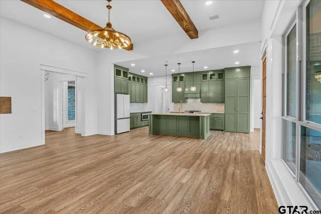 a kitchen with a sink and a stove