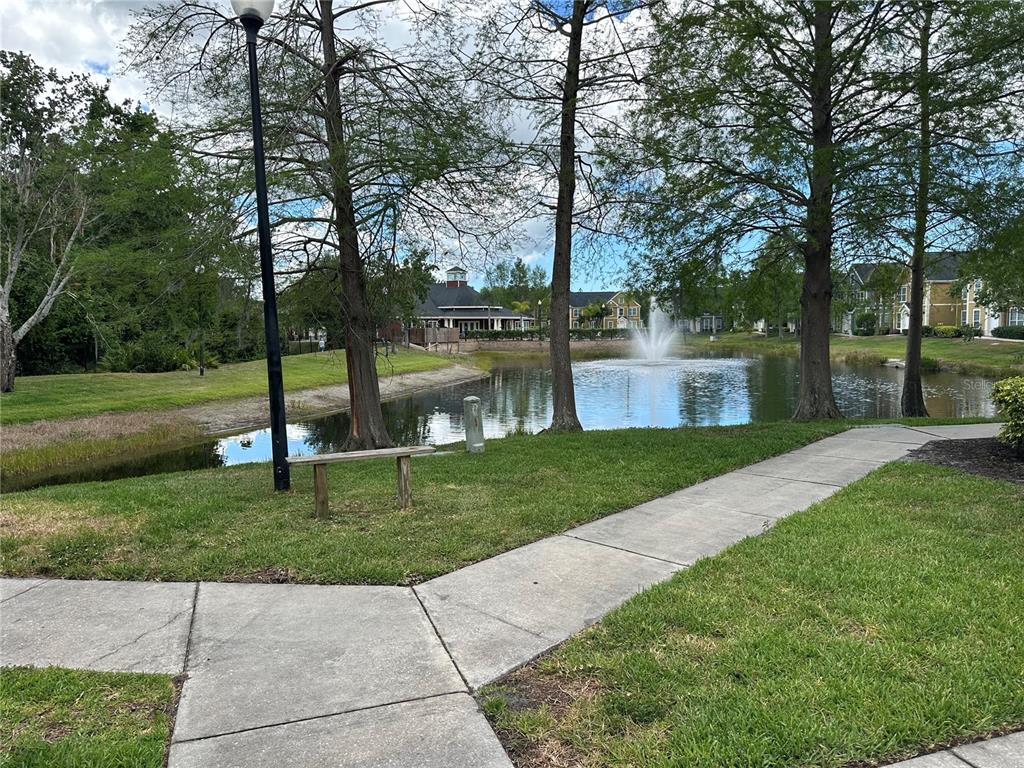 5601 Rosehill Road, Unit 201 Sarasota, FL 34233 - Photo 2 of 21 a garden view with a fountain