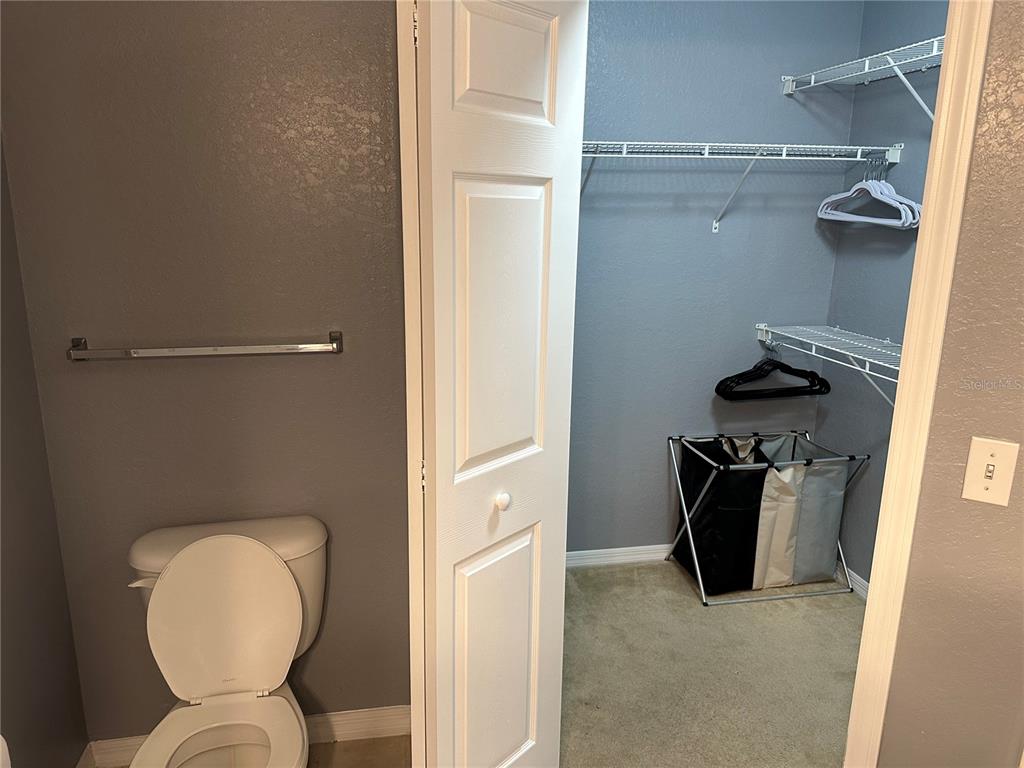 5601 Rosehill Road, Unit 201 Sarasota, FL 34233 - Photo 7 of 21 a bathroom with a sink and toilet