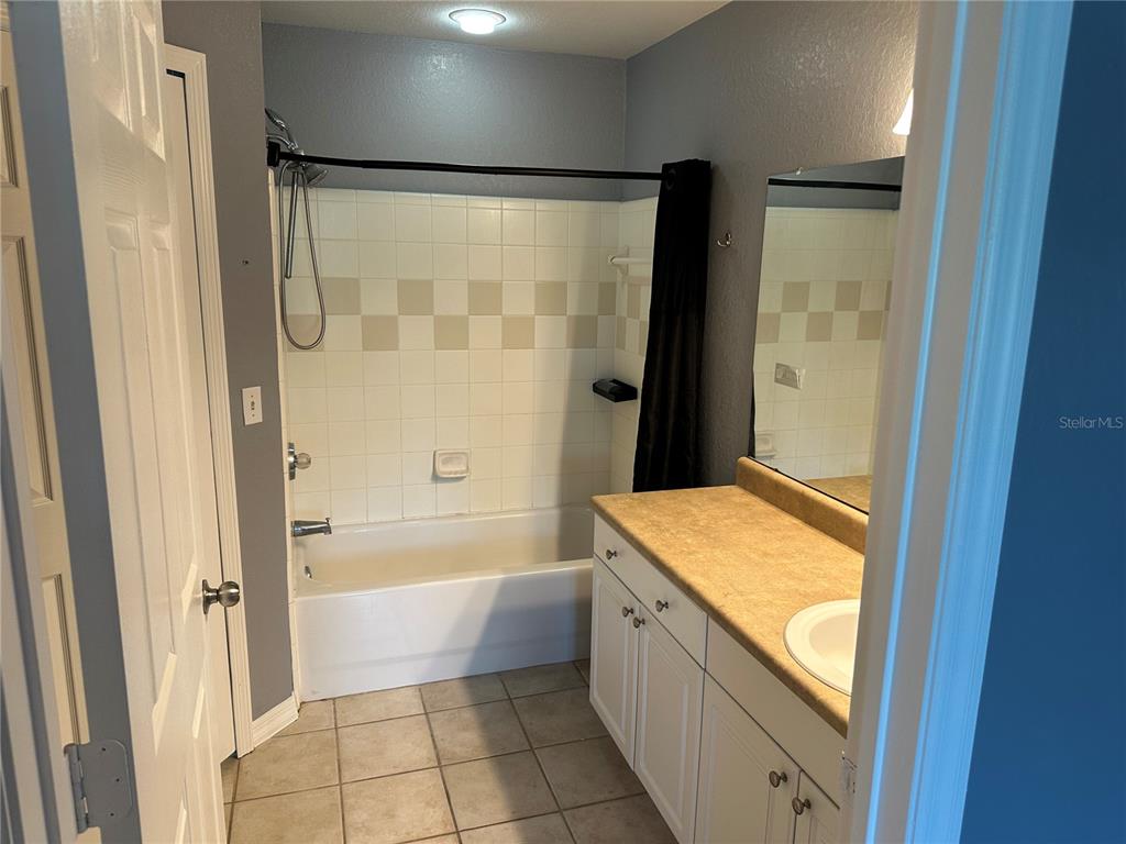 5601 Rosehill Road, Unit 201 Sarasota, FL 34233 - Photo 8 of 21 a bathroom with a bathtub and a shower