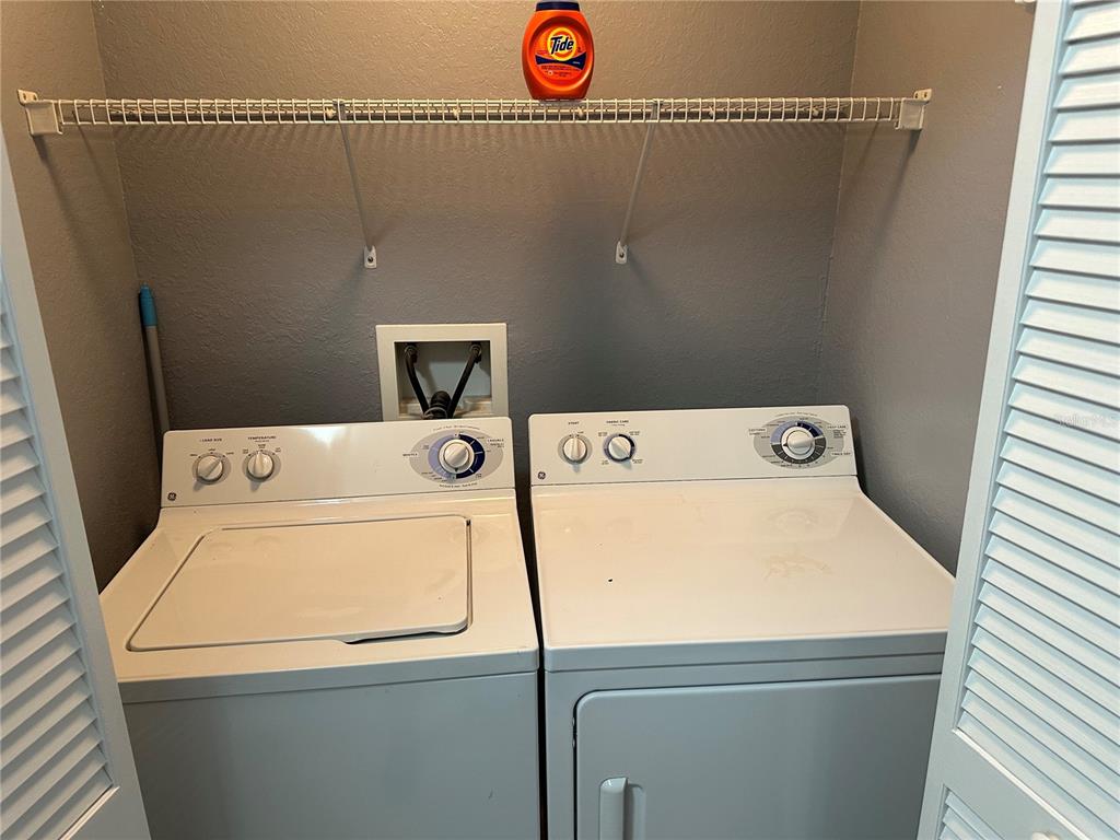 5601 Rosehill Road, Unit 201 Sarasota, FL 34233 - Photo 9 of 21 a utility room with dryer and washer