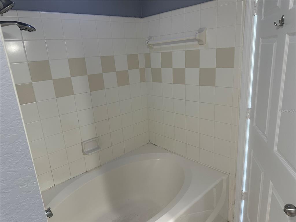 5601 Rosehill Road, Unit 201 Sarasota, FL 34233 - Photo 10 of 21 a close up of a bathtub