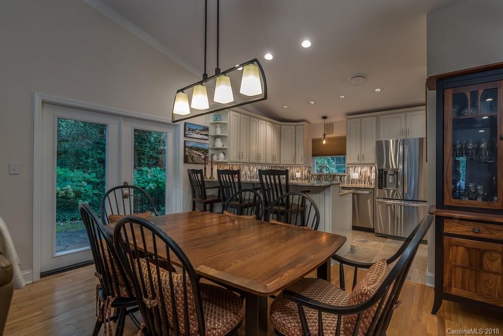 44 Jervey Road, Unit 3B Tryon, NC 28782 - Photo 11 of 29 a view of a dining room with furniture window and wooden floor