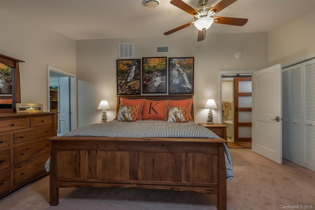 44 Jervey Road, Unit 3B Tryon, NC 28782 - Photo 18 of 29 a bedroom with a bed and a dresser