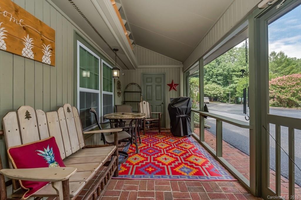 44 Jervey Road, Unit 3B Tryon, NC 28782 - Photo 3 of 29 a living room with furniture a rug and white walls