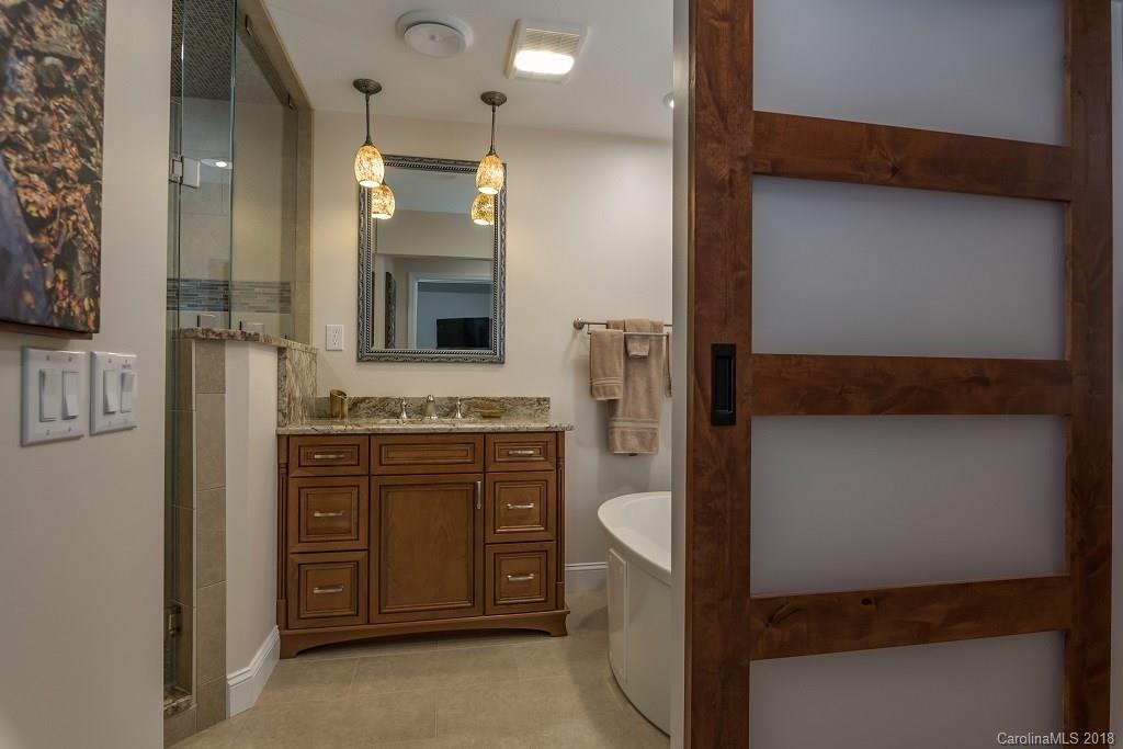 44 Jervey Road, Unit 3B Tryon, NC 28782 - Photo 21 of 29 a bathroom with a sink and a mirror