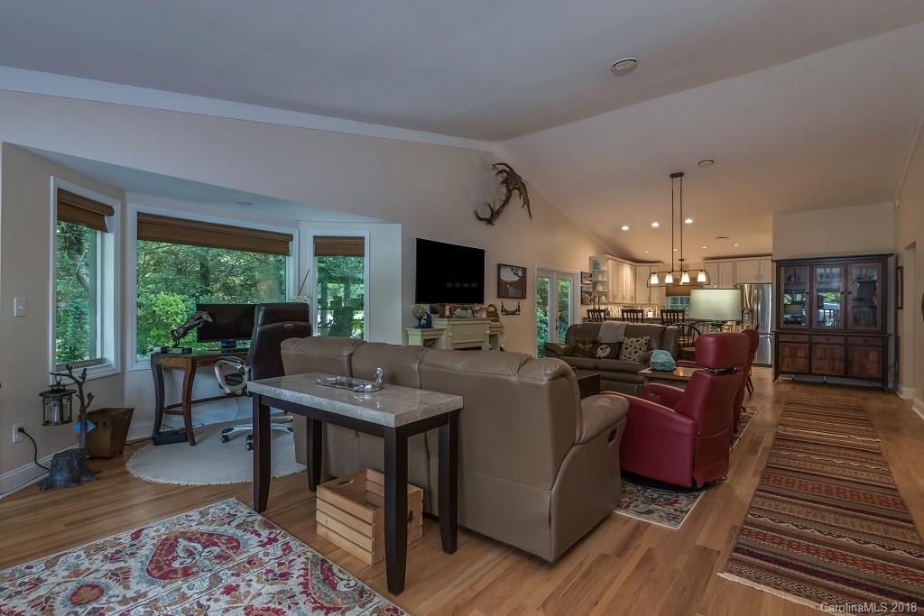 44 Jervey Road, Unit 3B Tryon, NC 28782 - Photo 6 of 29 a view of a livingroom with furniture window and wooden floor