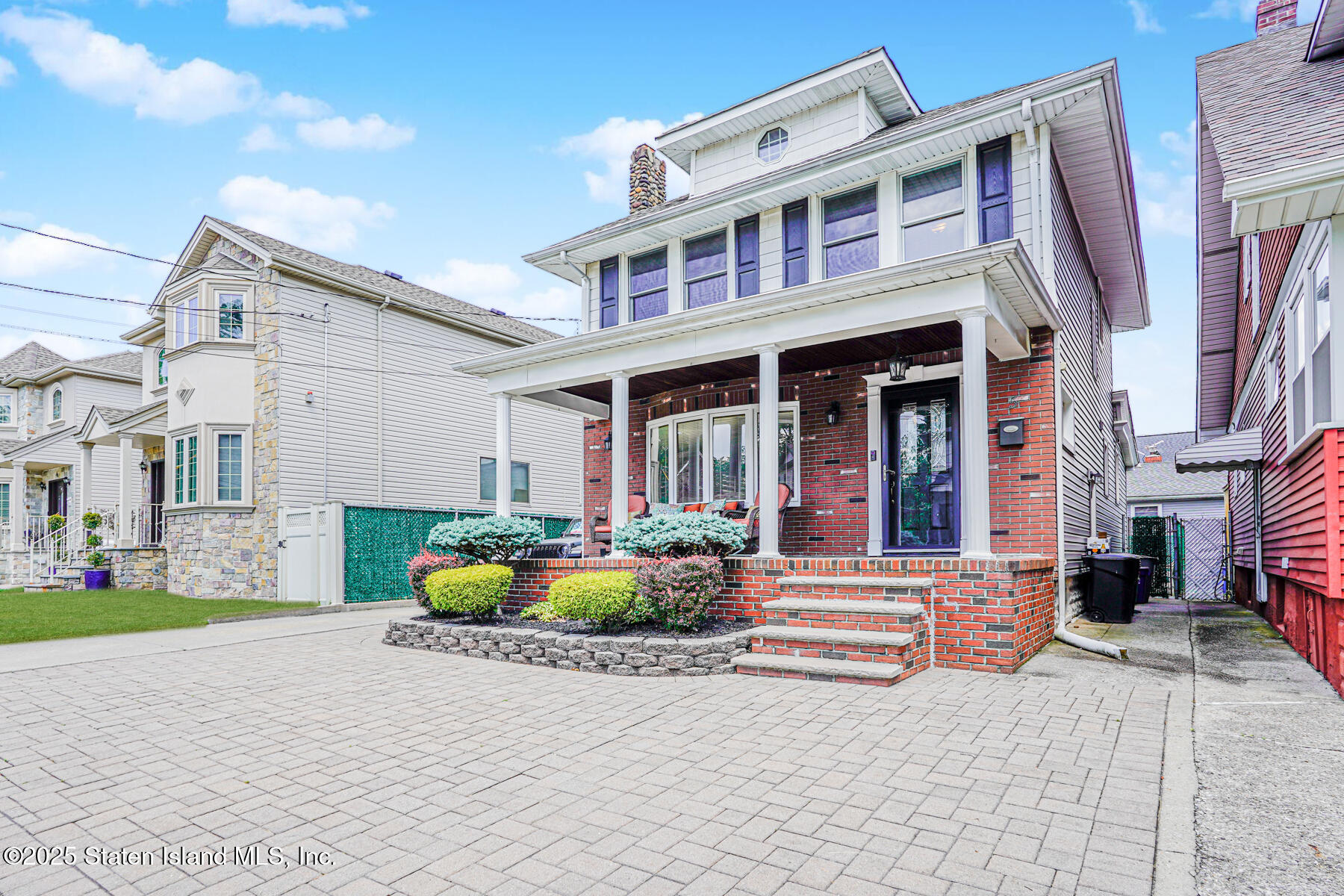 5 Highmount Road Staten Island, NY 10308 - Photo 2 of 3 a front view of brick house with a yard