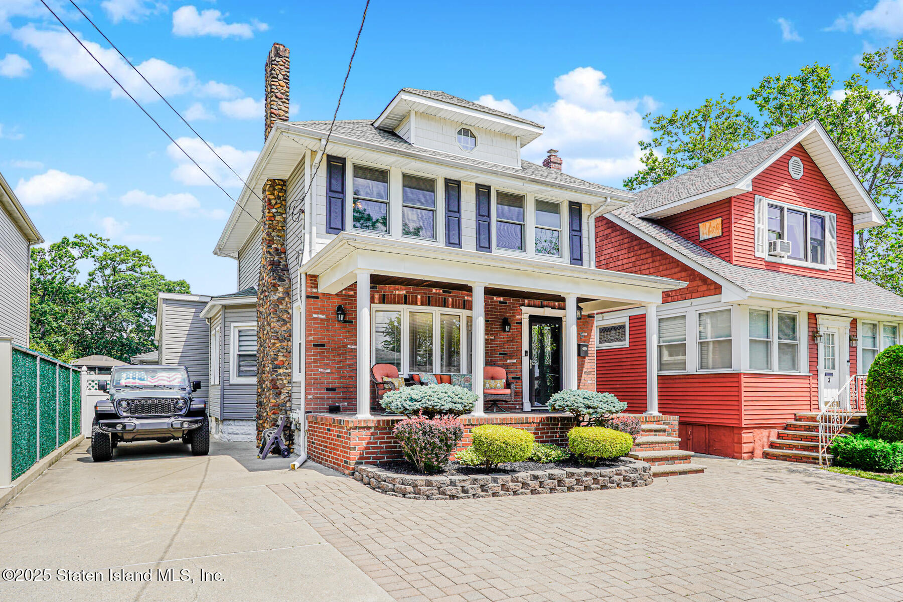 5 Highmount Road Staten Island, NY 10308 - Photo 3 of 3 a front view of a house with a yard and potted plants