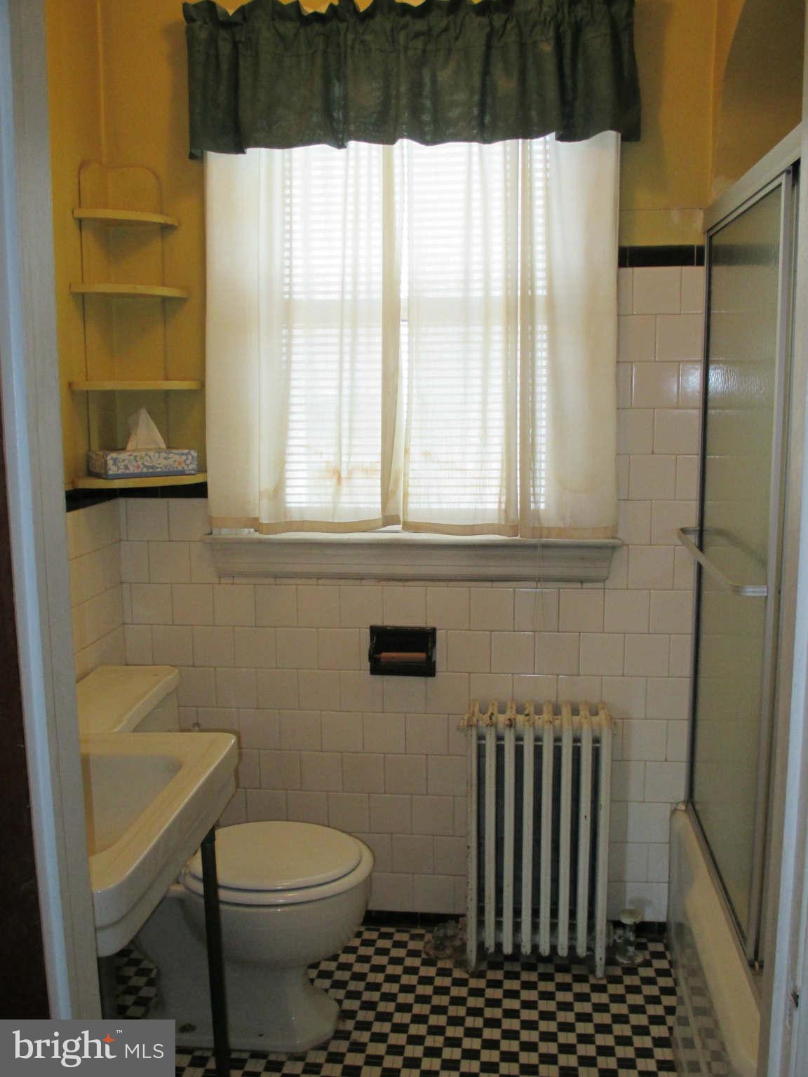 8126 Bon Air Road Baltimore, MD 21234 - Photo 14 of 28 a bathroom with a sink a toilet and shower
