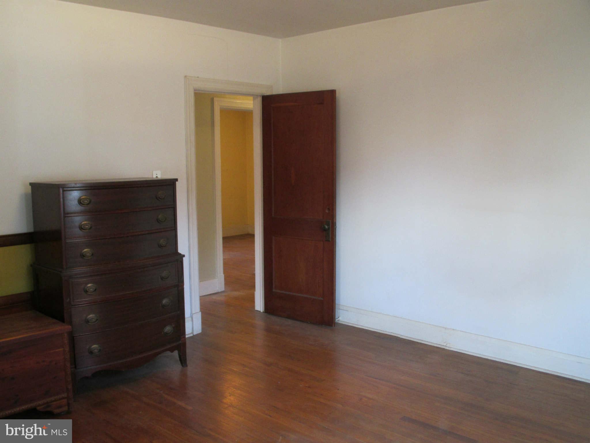 8126 Bon Air Road Baltimore, MD 21234 - Photo 16 of 28 an empty room with wooden floor