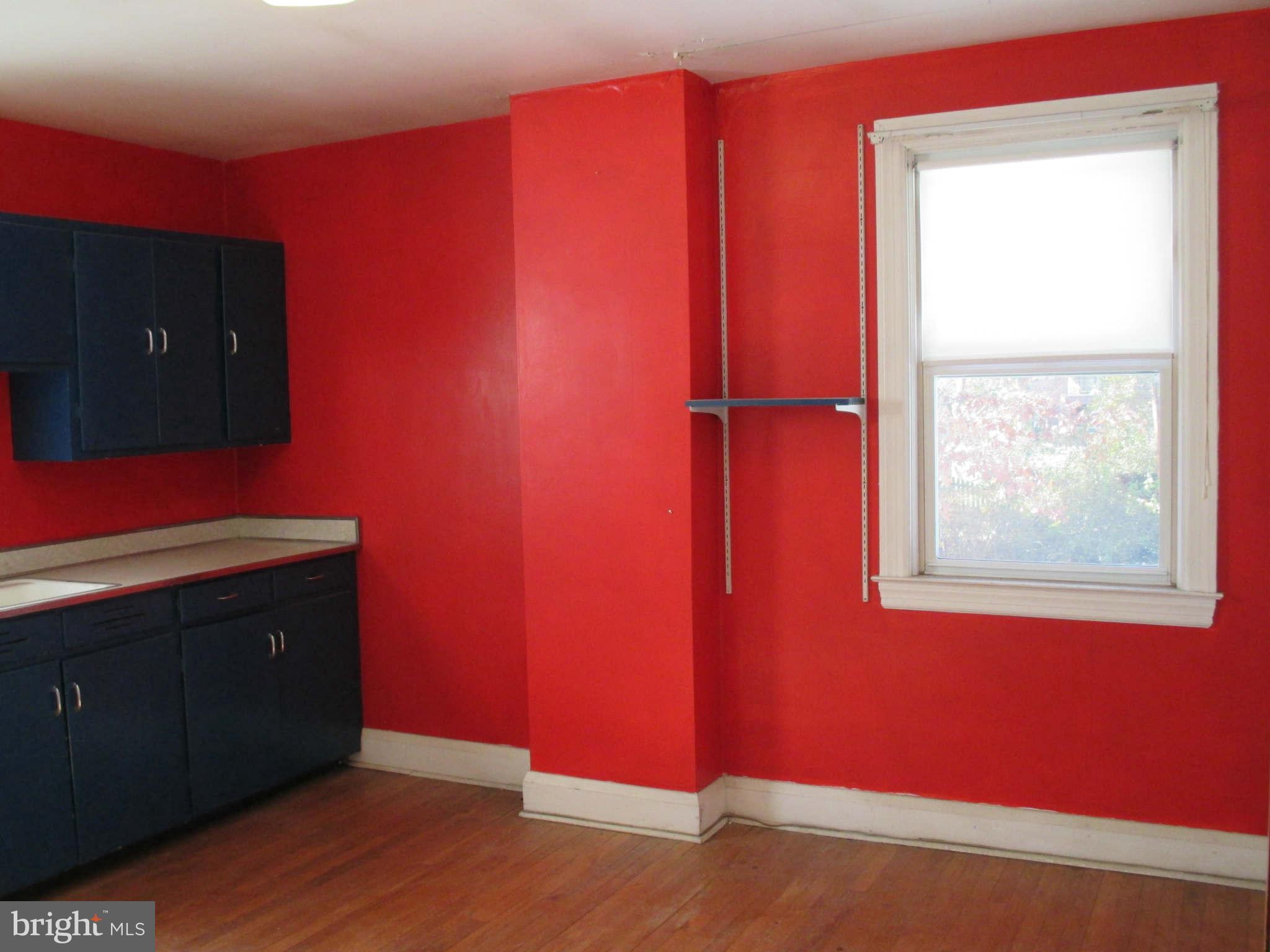 8126 Bon Air Road Baltimore, MD 21234 - Photo 18 of 28 a room with a chair and wooden floor