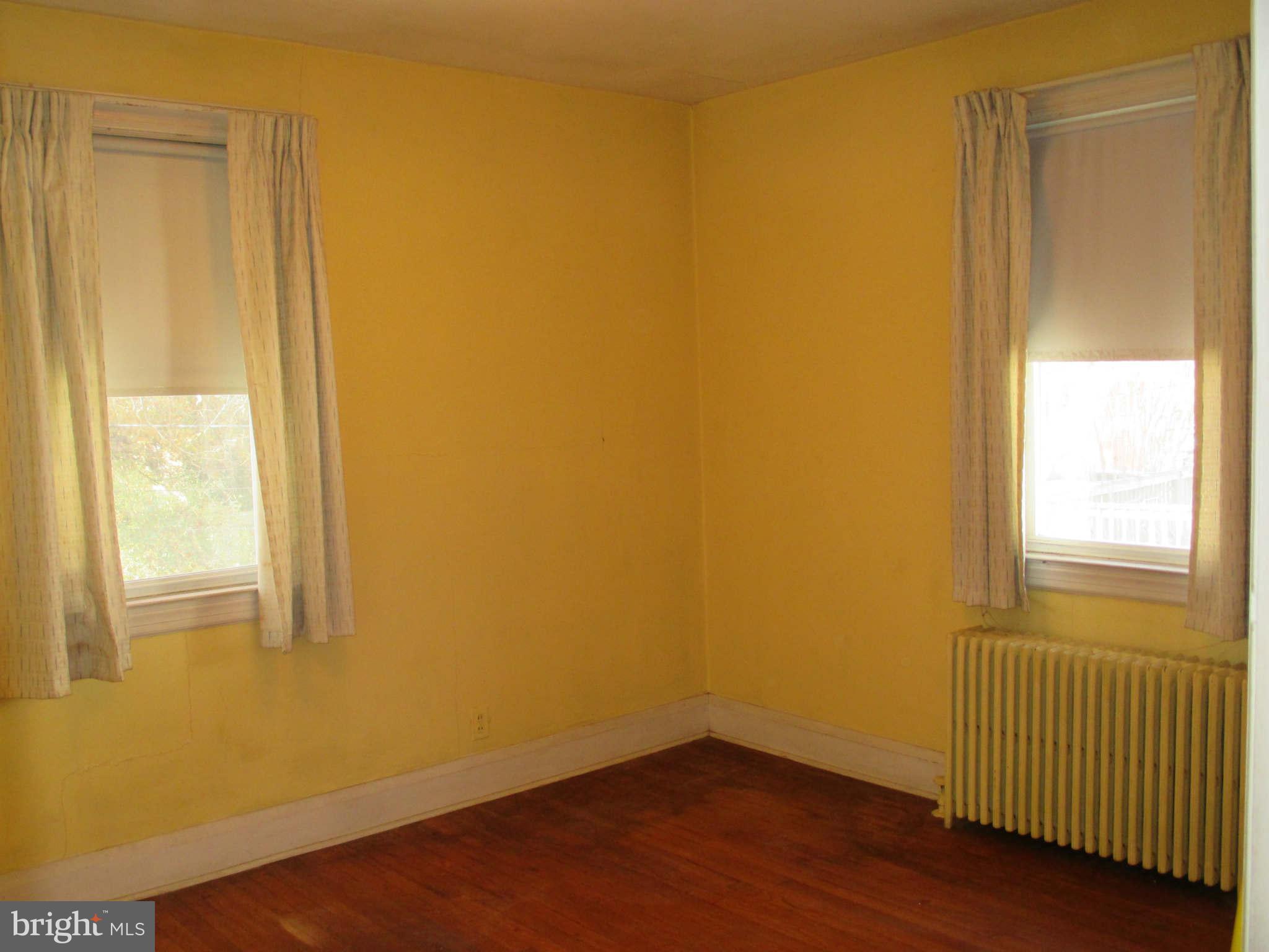 8126 Bon Air Road Baltimore, MD 21234 - Photo 20 of 28 a view of an empty room with wooden floor and a window