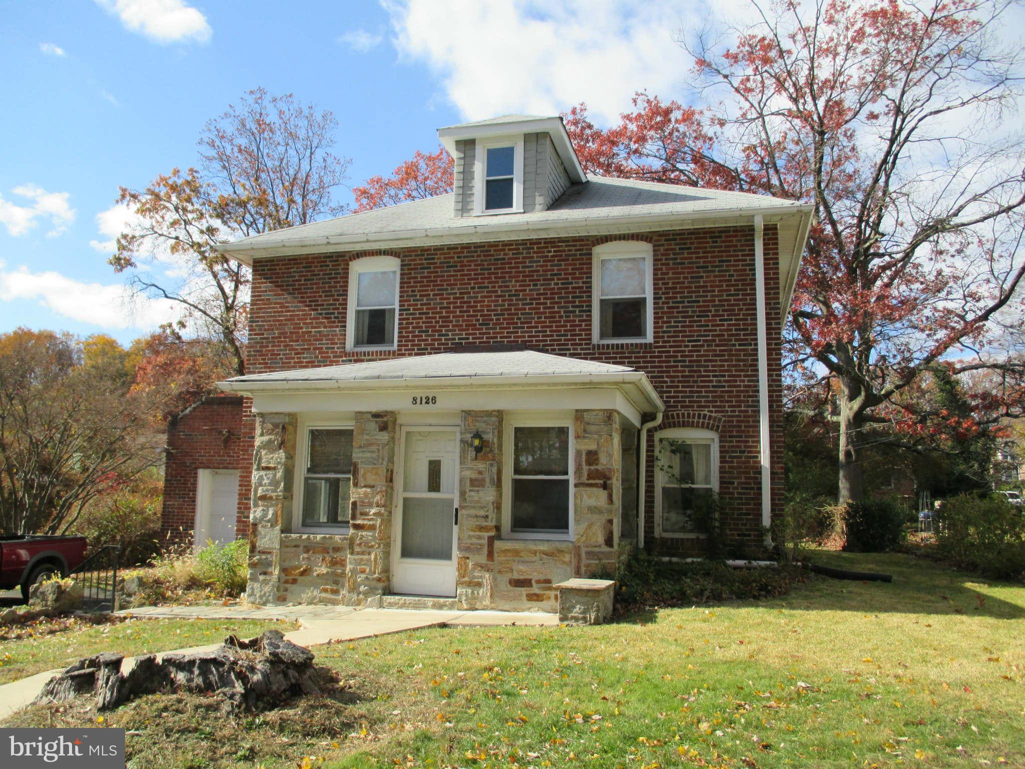 8126 Bon Air Road Baltimore, MD 21234 - Photo 3 of 28 a front view of a house with a yard