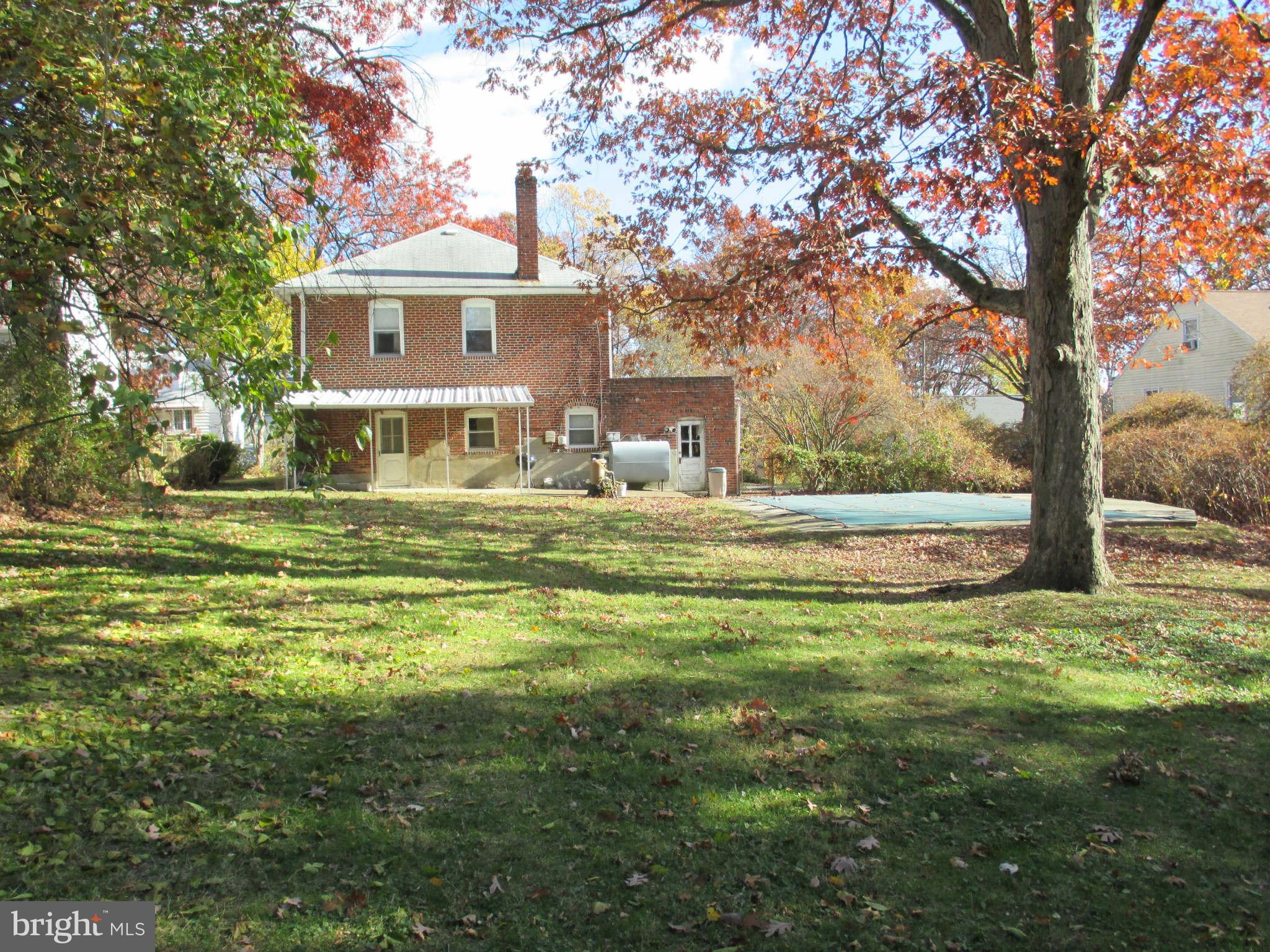 8126 Bon Air Road Baltimore, MD 21234 - Photo 28 of 28 a front view of a house with a garden