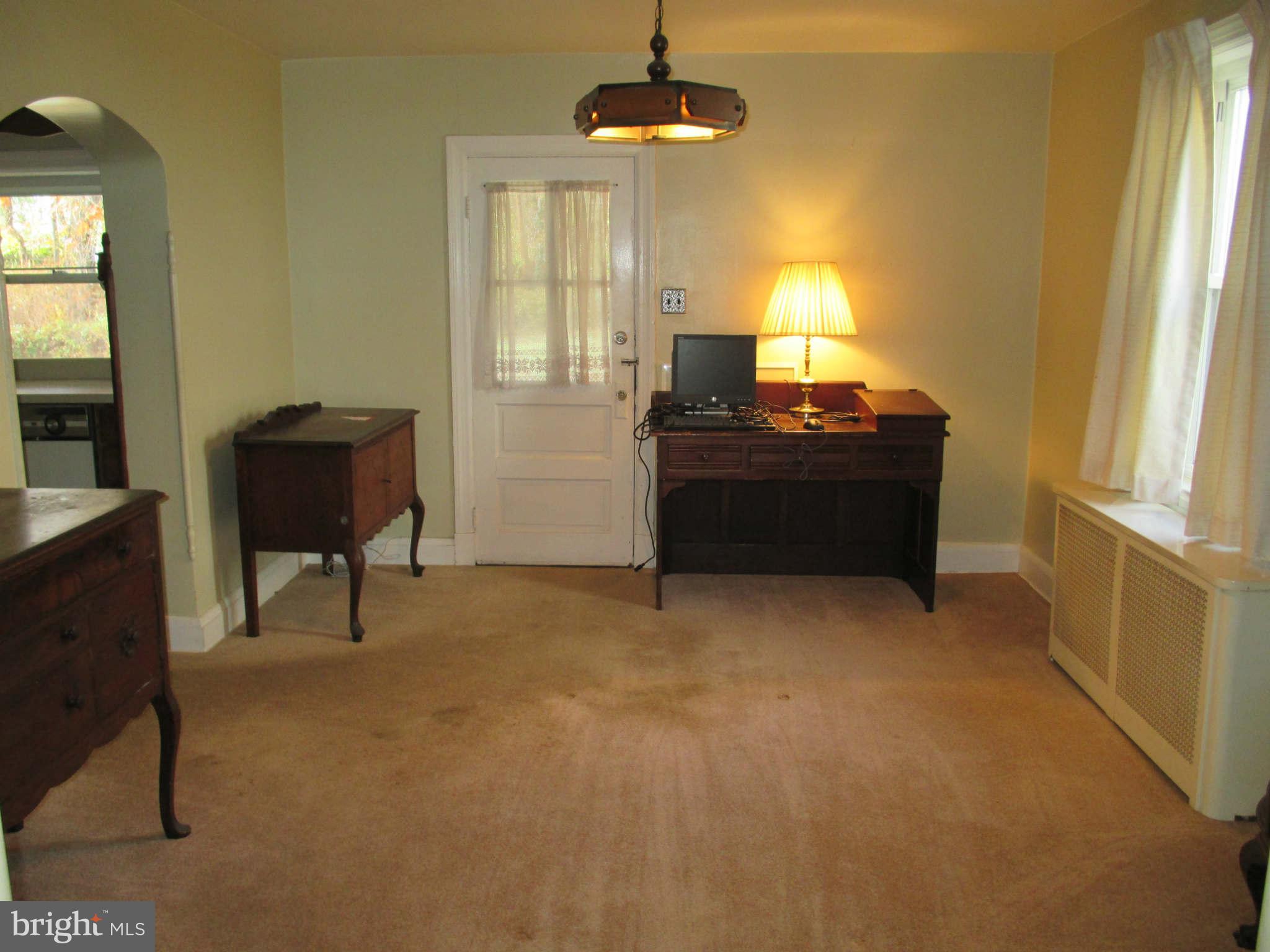 8126 Bon Air Road Baltimore, MD 21234 - Photo 8 of 28 a room with a bed and a chair