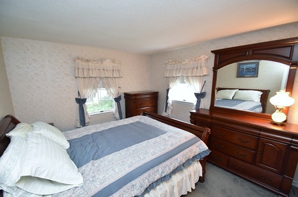 107 New Braintree Road Oakham, MA 01068 - Photo 11 of 22 a bedroom with a bed and a dresser