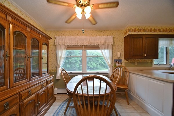 107 New Braintree Road Oakham, MA 01068 - Photo 5 of 22 a view of a dining room with furniture window and outside view